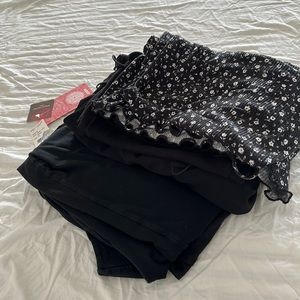 One jumpsuit, two maxi dresses, and three mini dresses in black